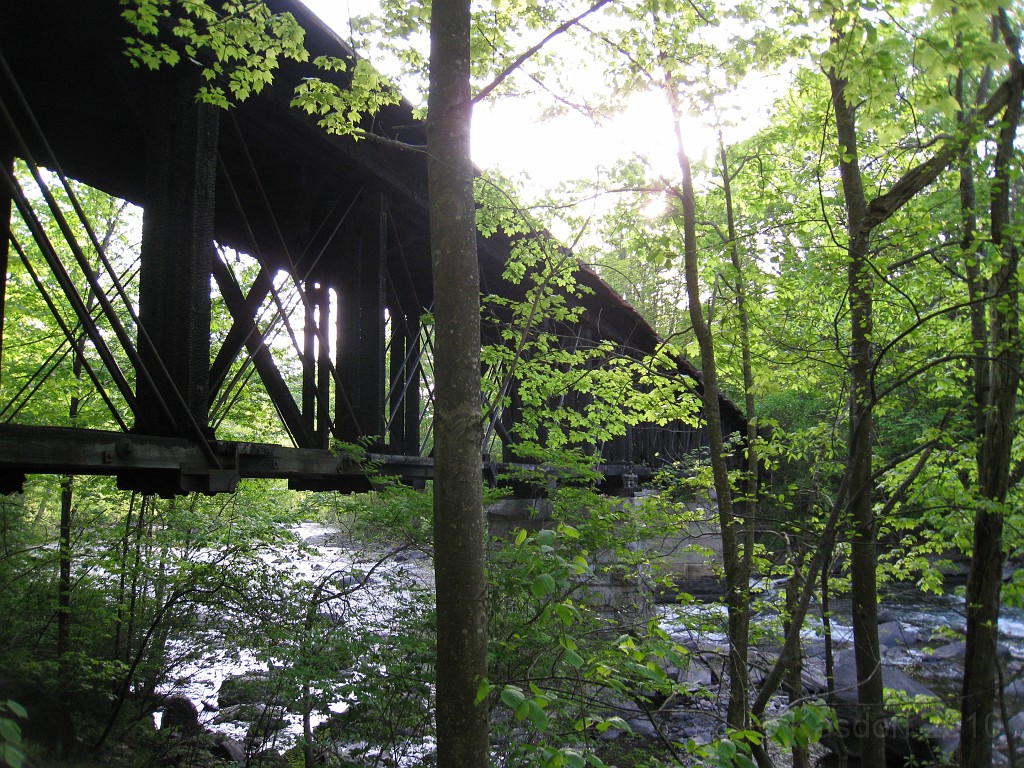 Tilton NH Rail Trail 2010 0255.jpg - Winnipesaukee River Trail, Franklin New HampshireTrestle View ParkInterested in taking a walk or bike ride on a scenic historic trail close to the downtowns of the twin rivers area, yet with the feel of wilderness. A 3 mile trail parallels the Winnipesauke river and passes the historic Sulphite upside down covered bridge believed to be the only one in the country and listed on the national register of historic places. You will also view mill ruins and remaining portions of dams that tell the history of the 5 mills that operated on this river in the mid 19th century.
